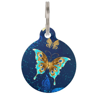 Médaillon Pour Animaux Papillons d'or sur un Arrière - plan bleu