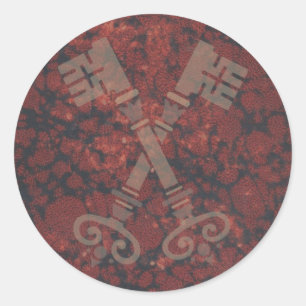 Medieval 21ste toetsen tegen donkerrode marmer ronde sticker