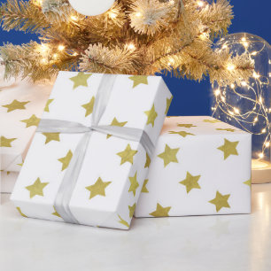 Meerdere gouden sterren op wit cadeaupapier