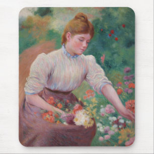 Meisje dat bloemen plukt in een zomertuin muismat