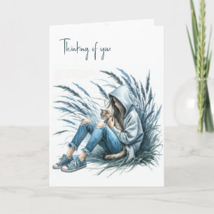 Meisje in een hoodie met een huiskat kaart