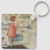 Meisje uit het verleden, kind doet wasgoed ophange sleutelhanger (Achterkant)