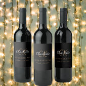 Meisjesuitje zwart goud monogram wijn etiket