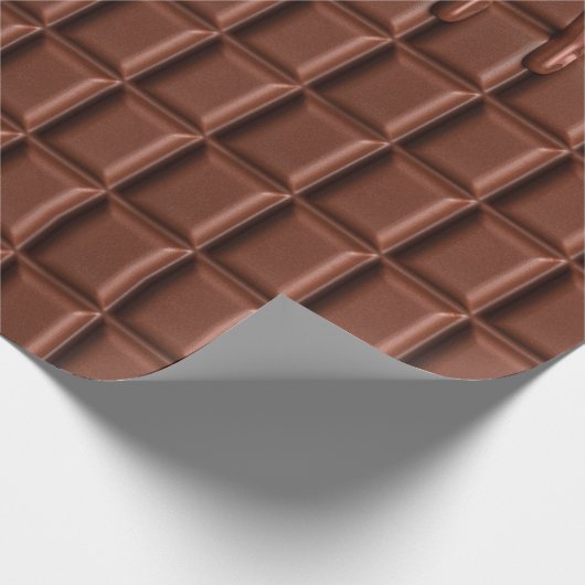 Melade chocolade die over een chocoladeblok druppe cadeaupapier (Hoek)