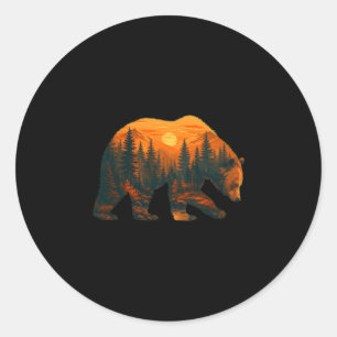 Mens beer silhouet met boslandschap en ronde sticker