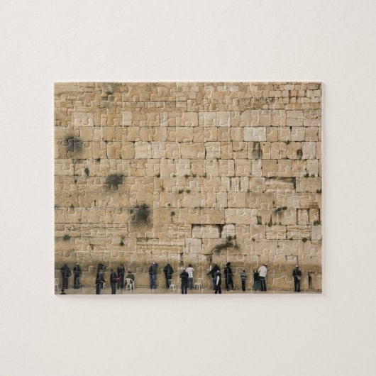 Mensen bidden aan de wand legpuzzel (Horizontaal)