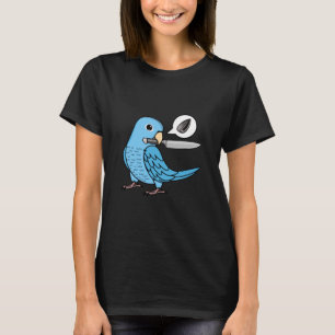 Messenpapegaai wil zaden in blauwe papegaai t-shirt