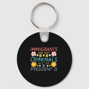 Migranten zijn geen criminelen, maar het President Sleutelhanger