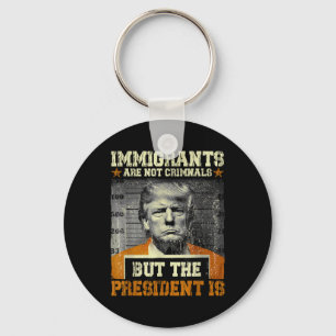 Migranten zijn geen criminelen, maar het President Sleutelhanger