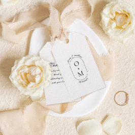 Minimaal geometrisch monogram met kalligrafie brui cadeaulabel