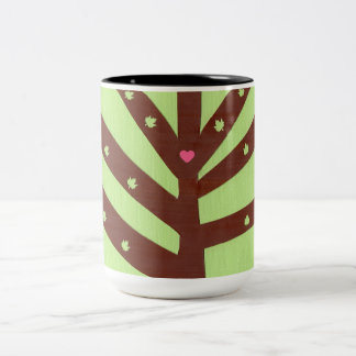Minimalistische boom met roze hart en bladeren tweekleurige koffiemok