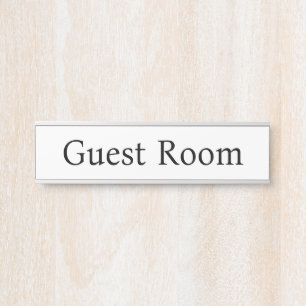 Minimalistische gastenkamer deurbordje