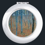 Miroir De Poche Gustav Klimt Beech<br><div class="desc">Il s'agit d'oeuvres de Gustav Klimt, Beech Grove 1, 1902. Les oeuvres d'art dépeignent une forêt dense de grands bouleaux, minces, aux troncs pâles marqués par des lignes verticales foncées. Le feuillage est dépeint dans les tons bleu, vert et jaune, ajoutant un sens de profondeur et de vibrations à la...</div>