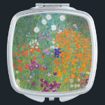 Miroir De Poche Paysage floral Gustav Klimt<br><div class="desc">Un miroir compact avec le tableau Art nouveau de Gustav Klimt (1862-1918),  Jardin aux fleurs (vers 1906). Un jardin rempli de pétunias colorés,  de masques et autres fleurs.</div>