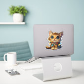 Mischievous Abessijnse kat gewikkeld in Kerstmis Sticker (Laptop op bureau)