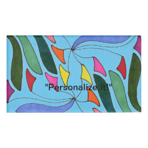 Mobiele kunst met bladvormen in meerdere kleuren naambadge
