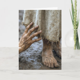 Modderige hand reikt naar Jezus Kaart
