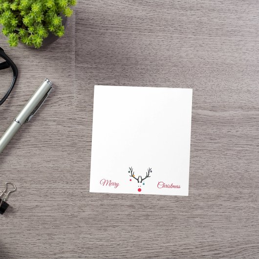 Moderne schattige abstracte kerstredeers op wit notitieblok
