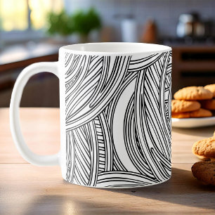 Moderne zwart-witte koffie mok met wervelingen.
