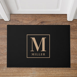 Moderne zwarte en bruine familienaam monogram deurmat