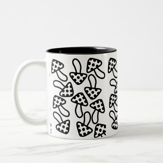 Mok zwarte en witte paddenstoelen (Links)