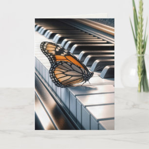 Monarch Butterfly op een piano toetsenbord Kaart