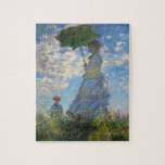 Monet La Femme Promenade avec un Puzzle Parasol<br><div class="desc">Claude Monet La Femme Promenade avec un casse-tête Parasol. Peinture à l'huile sur toile de 1875. L'une des oeuvres les plus charmantes de Monet, The Promenade, présente une jeune femme et un enfant debout dans un champ au-dessus de fleurs sauvages jaunes. La femme tient un parasol vert et bleu tandis...</div>