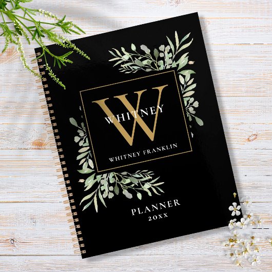 Monogramme de feuilles de verdure noires et dorées