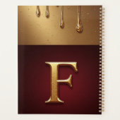 Monogramme de lettre F dorée avec métal qui coule (Dos)