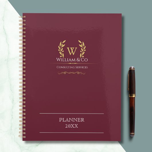 Monogramme d'or de la couronne de laurier classiqu