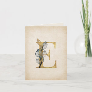 Monogramme E or et noir avec feuilles