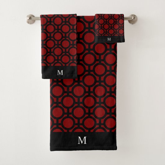 Monogramme et cercles abstraits noirs sur fond rou (En situation)