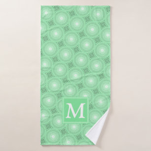 Monogramme vert ressort cercles motif