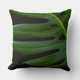 Monstera-blad van dichtbij kussen