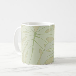 Monstera-bladeren in zacht groen koffiemok