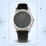 Montre Classic Laurel Wreath Black Gold Monogramme<br><div class="desc">Un design classique de couronne de laurier en noir et or,  offrant un parfait mélange de charme et d'élégance. Le monogramme apporte une touche spéciale. Idéal comme cadeau personnalisé pour la famille et les amis</div>