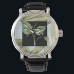 Montre Feuilles à l'instigation de la libellule par Jenni<br><div class="desc">Ce dessin de feuilles de Jennifer Goldberger présente l'apparition d'une libellule sur un arrière - plan noir. L'ambiance nocturne de l'entrée contraste agréablement avec l'ambiance diurne de l'impression de feuille. Commandez aujourd'hui !</div>