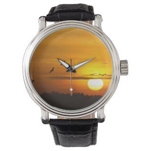 Montre Grues au lever du soleil