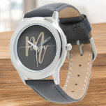 Montre Nom du monogramme Black Gold Modern Script<br><div class="desc">Élevez votre style avec le Monogramme moderne noir et or Monogram Name Watch. Doté d'un visage noir épuré et d'un monogramme d'or audacieux dans une police de script moderne, cette montre allie luxe et élégance intemporelle. L'artisanat de haute qualité assure à la fois durabilité et précision, tandis que le monogramme...</div>