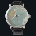 Montre Oiseau jaune, gris et beige perché sur une branche<br><div class="desc">Chariklia Zarris est connue pour ses oeuvres d'art abstraites. Dans ce dessin d'un profil d'oiseau sur un arrière - plan turquoise bleu,  elle saisit la simplicité de l'oiseau. Les fleurs blanches apportent une touche romantique. Customisez votre produit Zazzle préféré en utilisant cette belle image.</div>