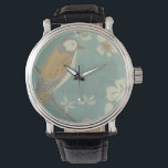 Montre Oiseau jaune, gris et beige perché sur une branche<br><div class="desc">Chariklia Zarris est connue pour ses oeuvres d'art abstraites. Dans ce dessin d'un profil d'oiseau sur un arrière - plan turquoise bleu,  elle saisit la simplicité de l'oiseau. Les fleurs blanches apportent une touche romantique. Customisez votre produit Zazzle préféré en utilisant cette belle image.</div>