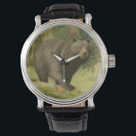 Montre Ours noir sur un tronc d'arbre<br><div class="desc">Ce dessin d'Oliver Kemp illustre un ours brun qui marche sur un arbre tombé dans une forêt. Les couleurs vert pastel sont apaisantes pour l'oeil et créent une agréable sensation de chaleur de l'éveil de la nature au printemps. Un grand ajout à tout décor rustique de maison!</div>