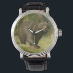 Montre Ours noir sur un tronc d'arbre<br><div class="desc">Ce dessin d'Oliver Kemp illustre un ours brun qui marche sur un arbre tombé dans une forêt. Les couleurs vert pastel sont apaisantes pour l'oeil et créent une agréable sensation de chaleur de l'éveil de la nature au printemps. Un grand ajout à tout décor rustique de maison!</div>