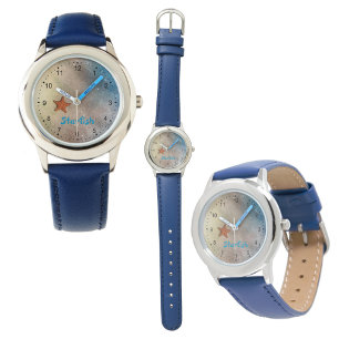 Montre Poisson orange sur la plage de sable