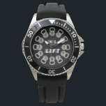 Montre Time to Lift Kettlebell<br><div class="desc">This bold Time to Lift watch features twelve kettlebells arranged around the dial,  each displaying a number for a unique and powerful fitness-inspired design. Set on a sleek black background with gray kettlebells and clean black clock hands,  this minimalist piece captures the strong aesthetic of modern gym spaces.</div>