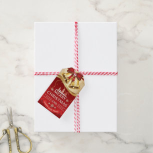 Mooie gouden kerstballetjes met rode boe cadeaulabel