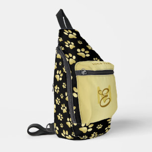 Mooie gouden pootafdrukken op een zwarte achtergro sling bag