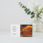 Mooie kerstlampjes op de kajuit van het log in sne visitekaartje (Staand voorkant)