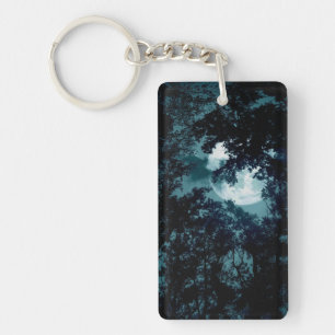 Mooie maan gloeit door bomen sleutelhanger