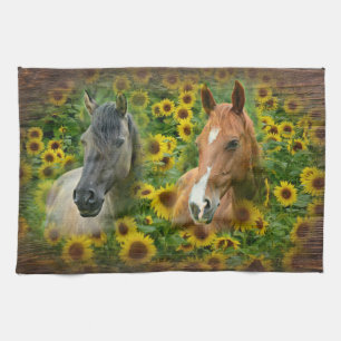 Mooie paarden op het gebied van zonnebloemen theedoek